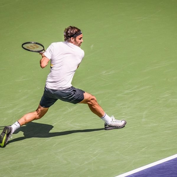 Federer hitting a one-handed backhand